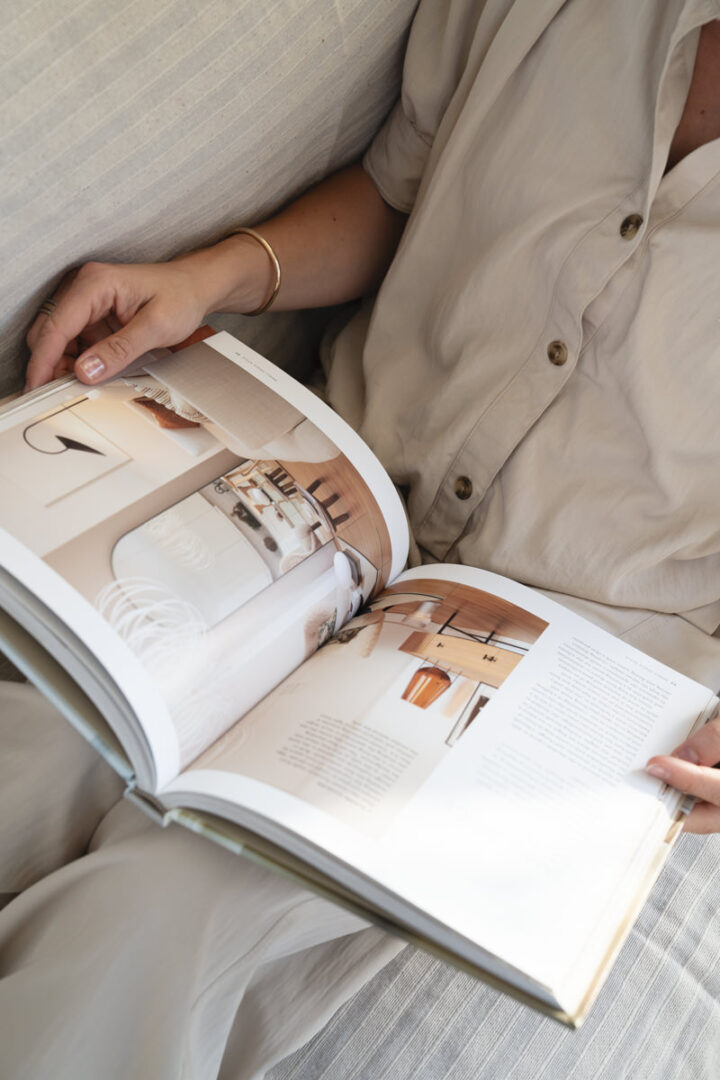 Tiare Brasseur interior design book close up hands beige shirt